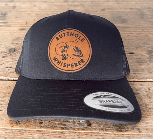 Butthole Whisperer Patched Hat | Black on Black Yupoong Classic Snapback | Funny Hat with Free Matching Keychain!